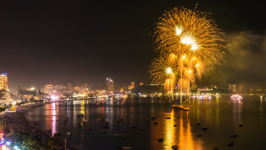 Golden fireworks display over Pattaya Bay as seen from one of the best viewing spots during Pattaya International Fireworks Festival 2026.