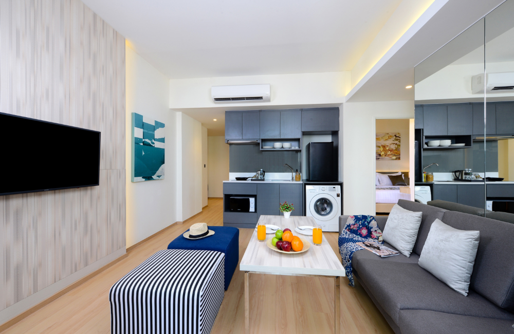 Spacious family suite with kitchenette, washing machine, and cozy living area at Arden Hotel Pattaya – ideal for long stays