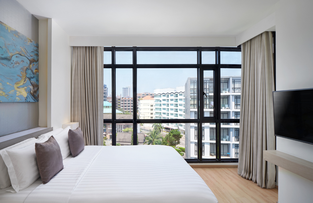 Bright and airy family bedroom with city view window at Arden Hotel Pattaya – comfort and convenience in Central Pattaya