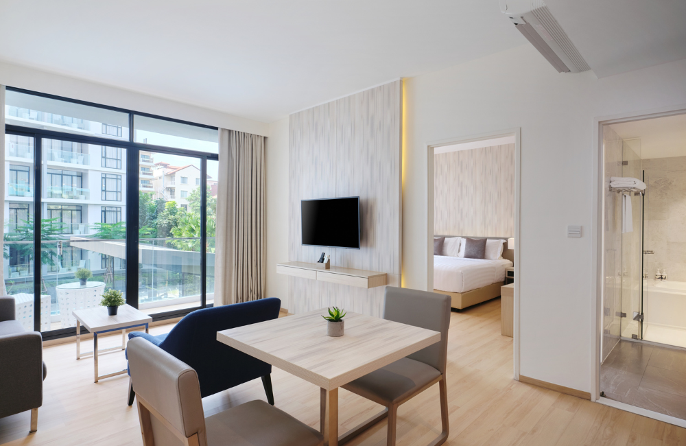 Spacious One Bedroom Executive Suite at Arden Hotel Pattaya with separate bedroom, living area, and pool view balcony.