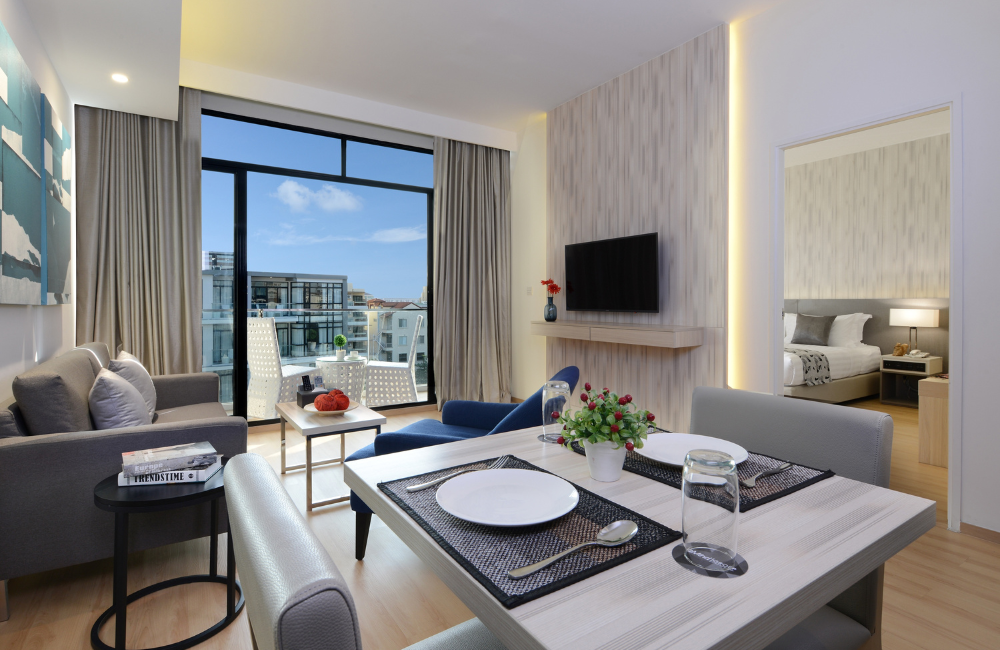 One Bedroom Executive Suite at Arden Hotel Pattaya with private bedroom, dining table, and balcony—perfect for long-term stays.
