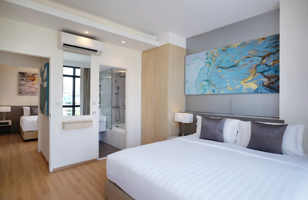 Two Bedroom Family Suite at Arden Hotel and Residence Pattaya with two separate bedrooms, private bathrooms, and modern furnishings.