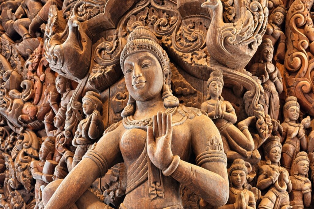 Detailed wooden sculptures and carved figures at the Sanctuary of Truth in Pattaya, showcasing intricate craftsmanship, symbolic forms and traditional design.
