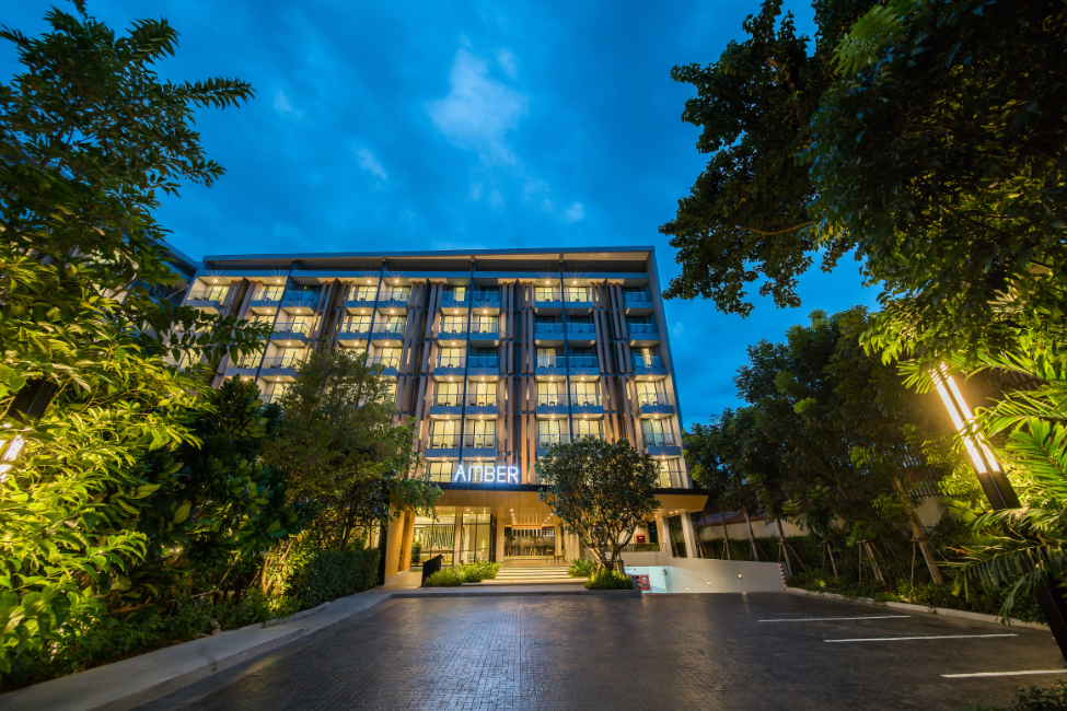Hotel Amber Pattaya illuminated at night, offering a peaceful stay near Soi Buakhao nightlife.