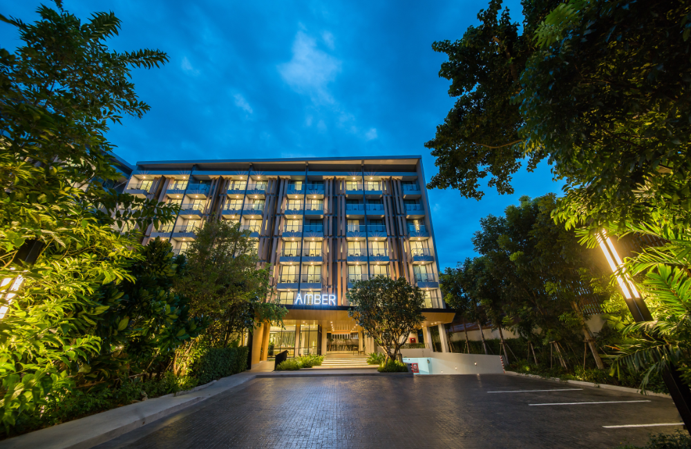Hotel Amber Pattaya illuminated at night, offering a peaceful stay near Soi Buakhao nightlife.
