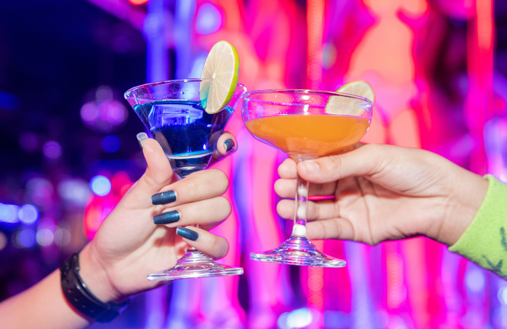 Colorful cocktails with lime at a vibrant bar in Pattaya nightlife near Hotel Amber Pattaya.