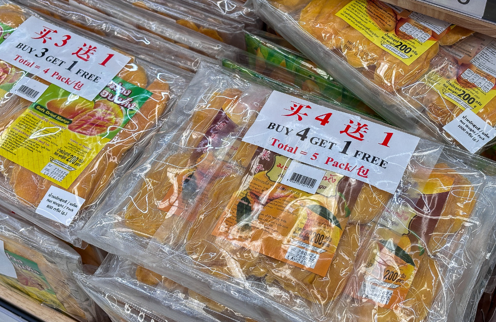 Packaged dried mango with a 'Buy 4 Get 1 Free' promotion, displayed neatly with clear labeling for a sweet and convenient snack option.