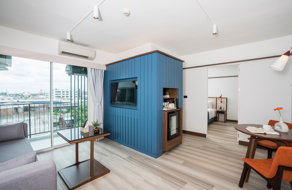 Spacious Grand Corner Suite at Hotel Amber Sukhumvit 85 with separate bedroom and city view