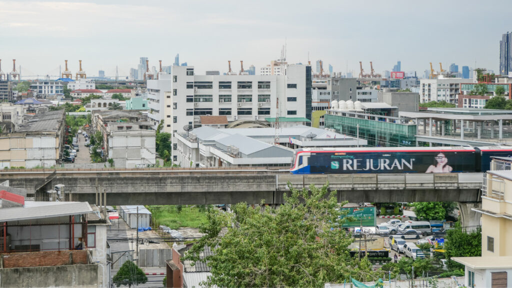 City view of Bangkok with BTS Skytrain passing near Hotel Amber Sukhumvit 85