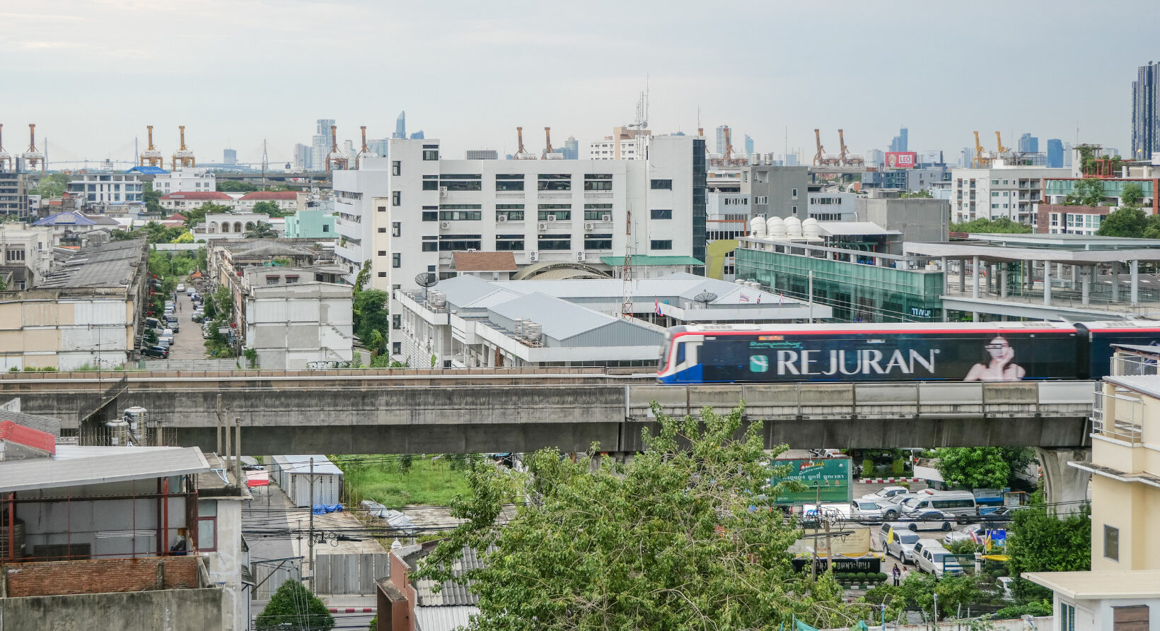 City view of Bangkok with BTS Skytrain passing near Hotel Amber Sukhumvit 85