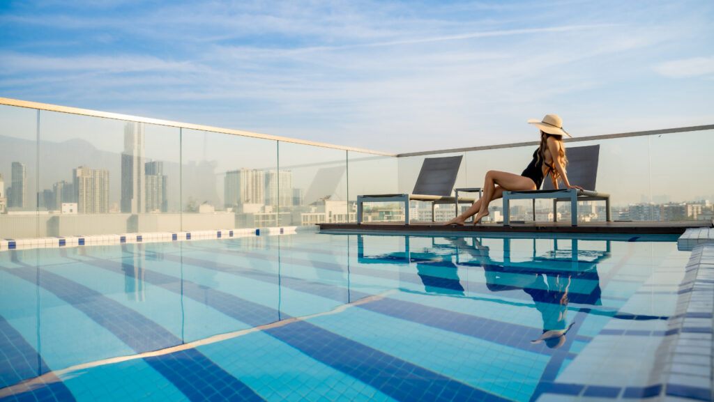 Rooftop swimming pool at Hotel Amber Sukhumvit 85 with Bangkok city view