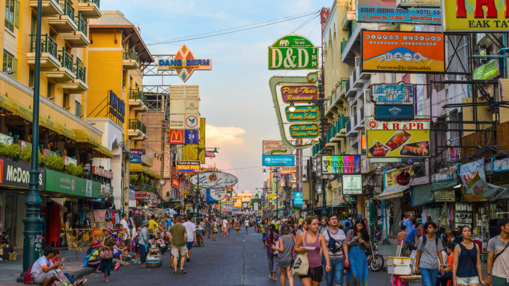 Busy evening scene on Khaosan Road market with tourists and shops