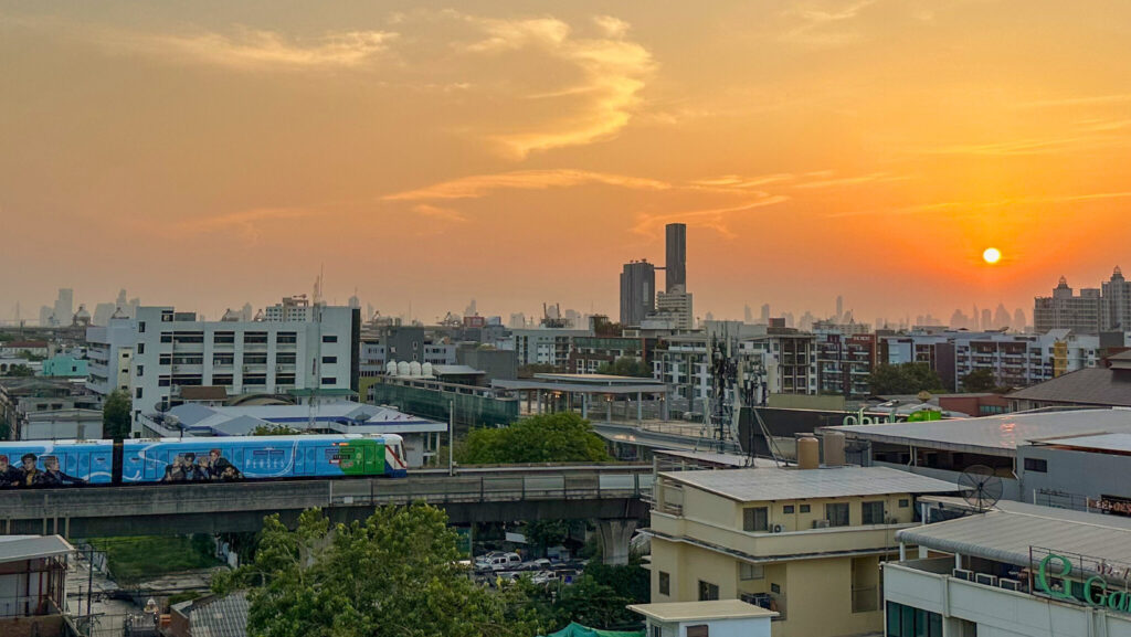 Sunset city view from Hotel Amber Sukhumvit 85 near BTS On Nut, showcasing why it’s a top budget hotel in Bangkok near BTS.