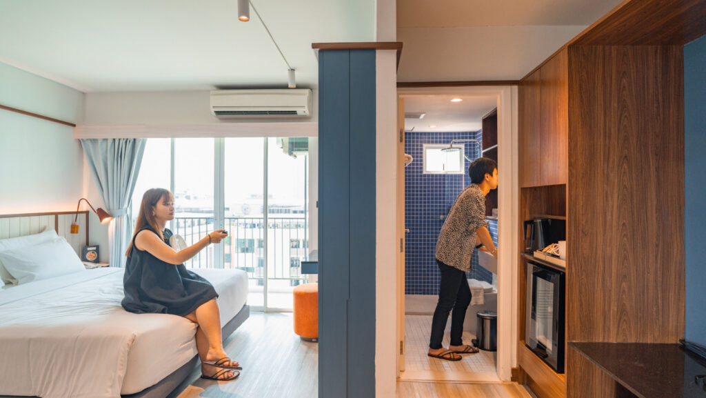 Spacious guest room at Hotel Amber Sukhumvit 85, a budget hotel in Bangkok near BTS, ideal for travelers seeking comfort in Sukhumvit.